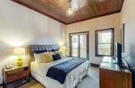 Primary bedroom offers King, en suite bathroom, and balcony access 